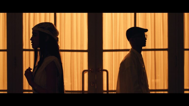 Silhouette of Jady and Princess Jenna Norodom standing against a warm, backlit window in the Way You Are music video.